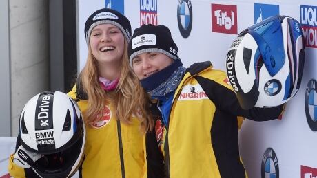 Ann-Christin Strack, left, and Stephanie Schneider of Germany celebrate after winning the women's two-women bobsleigh World Cup on Saturday. AUSTRIA BOBSLEIGH WORLD CUP