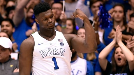 Duke's Zion Williamson reacts after a dunk in the first half of the Blue Devils' 72-70 victory over the previously unbeaten Virginia Cavaliers on Saturday. williamson-zion-011919