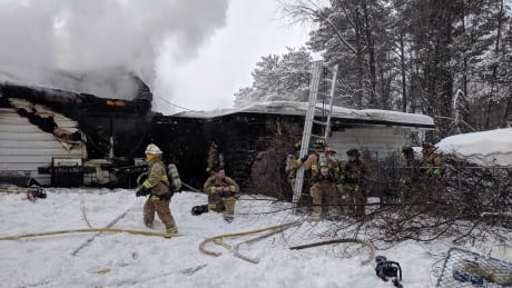 Firefighters tackle flames and smoke coming from a two-storey home on Woodroffe Avenue in Ottawa on Jan. 20, 2019. Four dogs died in the fire and two people were displaced. fire woodroffe avenue dogs killed ottawa