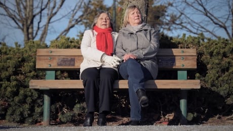 Juliette Harvey and her niece Loretta Byrnes sit on a tribute bench they bought for Byrnes' grandparents and parents in Garry Point Park in the late 1990s. Tribute bench