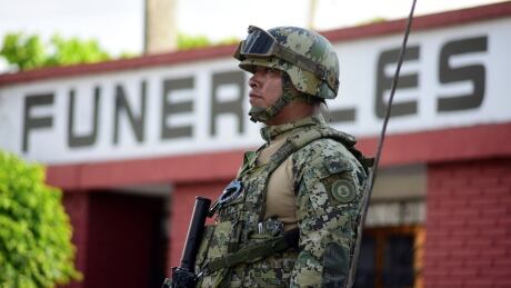 A Mexican soldier stands guard outside the funeral parlor where the wake of Valeria Medel, the daughter of Mexican congresswoman Carmen Medel that was killed on Thursday at a gym, is held in Ciudad Mendoza, in the Mexican state of Veracruz, Mexico November 9, 2018. REUTERS/Oscar Martinez - RC1C1966D950 MEXICO-VIOLENCE/