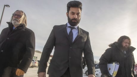 Jaskirat Singh Sidhu, the driver of the truck that struck the bus carrying the Humboldt Broncos hockey team leaves with his lawyers Mark Brayford, right, and Glen Luther after the third day of sentencing hearings in Melfort, Sask. jaskirat singh sidhu