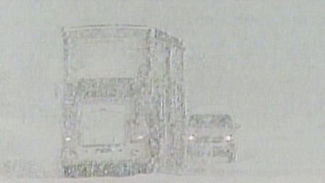 Vehicles are seen driving during a major snowstorm in Terrace, B.C., on Feb. 11, 1999. 1999 snowstorm in Terrace, B.C.