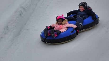Kids slide in Gatineau's Jacques Cartier Park during Winterlude 2019. ottawa gatineau winterlude winter weather