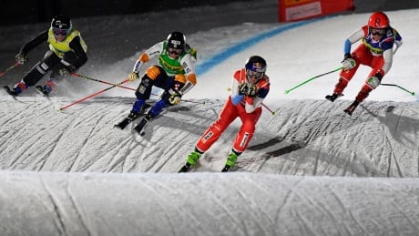 epa07237720 (L-R) Brittany Phelan of Canada, Sandra Naeslund of Sweden, Fanny Smith of Switzerland, and Sixtine Cousin of Switzerland speed down the track during the women's Ski Cross World Cup event in Arosa, Switzerland, 17 December 2018. EPA-EFE/GIAN EHRENZELLER ski-cross-world-cup