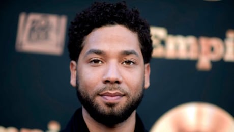 FILE - In this May 20, 2016 file photo, actor and singer Jussie Smollett attends the "Empire" FYC Event in Los Angeles. Chicago police say they're interviewing two "persons of interest" who surveillance photos show were in the downtown area where Smollett says he was attacked last month. A police spokesman said Thursday the two men aren't considered suspects but may have been in the area at the time Smollett says he was attacked. Smollett says two masked men shouted racial and homophobic slurs before beating him and putting a rope around his neck on Jan. 29. Jussie Smollett-Profile