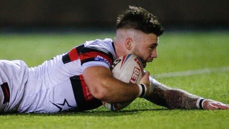 Wolfpack's Andy Ackers scores one of his two tries in Saturday's 30-6 drubbing of Widnes Vikings in Betfred Championship rugby league play at Newcastle, England. Toronto scored three tries in a 10-minute stretch during the second half ackers-andy-190216-1180