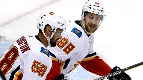Flames' checking forwards fill scoresheet to beat Penguins