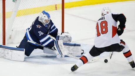 Dzingel leads Sens past Jets in OT