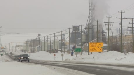 A sign on the Alaska Highway between Dawson Creek and Fort St. John illustrates how heavy industry and natural habitat for endangered species often share overlapping areas. Caribou Peace region