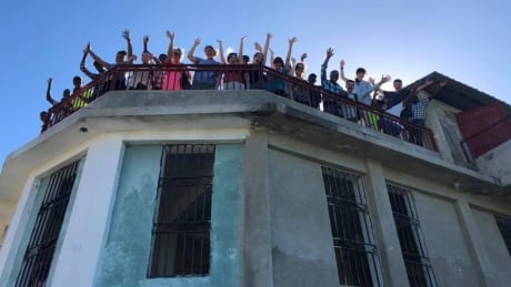 Members from Heart to Heart Children's Home pose in Haiti during less turbulent times. Haiti medical professionals