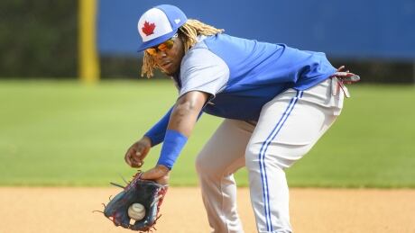 Toronto Blue Jays infielder Vladimir Guerrero Jr. catches a ground ball at practice during baseball spring training in Dunedin, Fla., on Monday. guerrero-vlad-021819