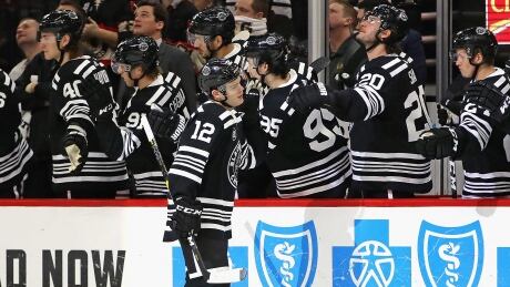 Chicago Blackhawks forward Alex DeBrincat (12) scored three goals and added two assists in an 8-7 win over the visiting Ottawa Senators on Monday. bb122540_2019021881117900.jpg