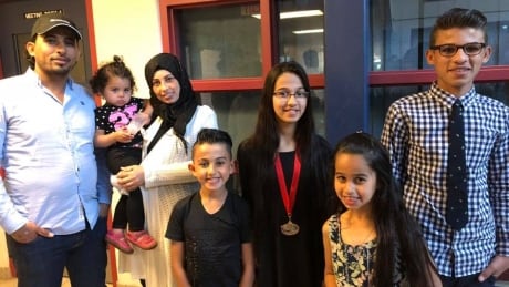 Five of the Barho children with their parents, in an undated photo posted to Facebook by the Halifax mosque the family attended. Barho family