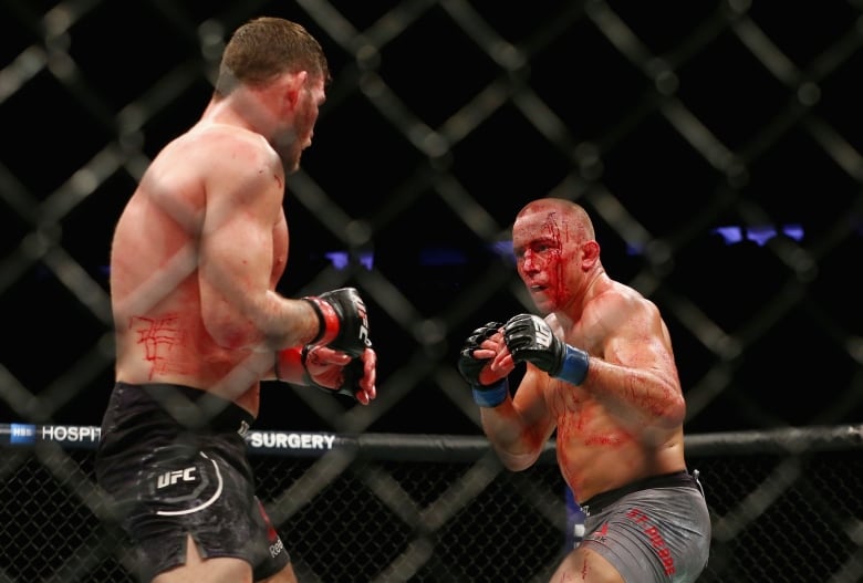 Michael Bisping and George St-Pierre face off at UFC 217 weigh-ins as the trash  talk continues