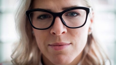 Former WestJet flight attendant Mandalena Lewis sits for a photograph in Vancouver, B.C., on Tuesday March 8, 2016. Lewis, fired after reporting an alleged sexual assault by one of the airline's pilots, says she is shocked at the positive response she's received since sharing her story publicly. WestJet Sex Assault 20160309