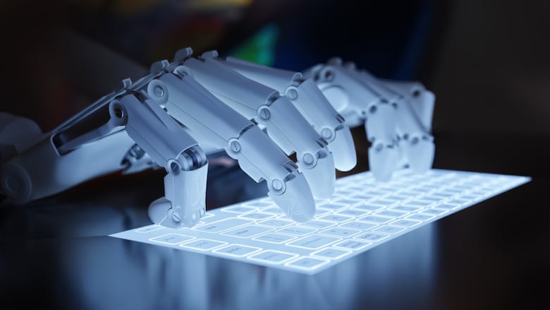 Robotic hands type on a keyboard