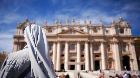 FILE - In this Wednesday, Sept. 26, 2018 file photo, a nun waits for the arrival of Pope Francis for his weekly general audience, in St. Peter's Square at the Vatican. The Catholic Church's global organization of nuns has denounced the "culture of silence and secrecy" surrounding sexual abuse and is urging sisters who have been abused to report the crimes to police and their superiors. The Associated Press reported earlier this year that the Vatican has known for decades about the problem of priests and bishops preying on nuns but has done next to nothing to stop it. Vatican Nun Abuse