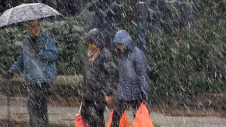 Pedestrians endure snowy conditions in Vancouver on Feb 22., 2019. Pedestrians snowy conditions Vancouver 22 Feb 2019