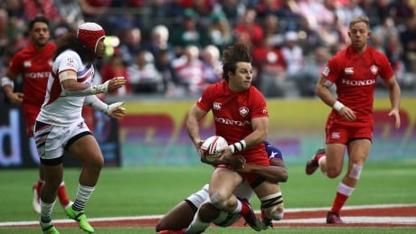 Canadian Pat Kay of Canada is tackled during a match against Team USA at the 2018 Canada Sevens. 99538040
