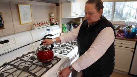 Semiahmoo band councillor Joanne Charles boils some water in a kettle. Joanne Charles