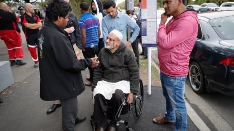 Farid Ahmed, center, a 59-year-old survivor of the Friday mosque attacks, talks with other relatives outside an information center for families, Saturday, March 16, 2019, in Christchurch, New Zealand. (AP Photo/Vincent Thian) New Zealand Mosque Attack The Victims