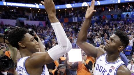 Duke's RJ Barrett, left, and Zion Williamson celebrate after defeating Florida State in the Atlantic Coast Conference tournament championship game in Charlotte, N.C., on Saturday. ncaa-march-madness-duke-031619-620
