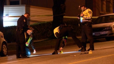 VPD collision analysts photograph evidence left at the crash scene. FRASER STREET HIT AND RUN MAR 2019