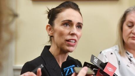 WELLINGTON, NEW ZEALAND - MARCH 19: Prime Minister Jacinda Ardern speaks to media at Parliament as New Zealand Considers Gun Law Reforms on March 19, 2019 in Wellington, New Zealand. 50 people were killed, and dozens are still injured in hospital after a gunman opened fire on two Christchurch mosques on Friday, March 15. The accused attacker, 28-year-old Australian, Brenton Tarrant, has been charged with murder and remanded in custody until April 5. The attack is the worst mass shooting in New Zealand's history. (Photo by Mark Tantrum/Getty Images) Jacinda Ardern scrum March 19
