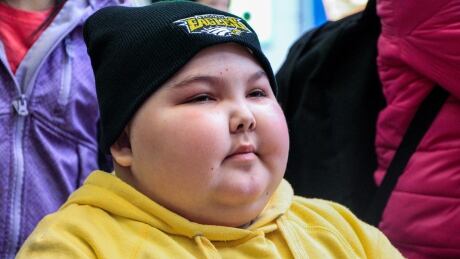 Kailyn Danielson sits in her wheelchair as she's surrounded by her classmates at Winnipeg James Armstrong Richardson International Airport, after not seeing them in months. Kailyn Danielson