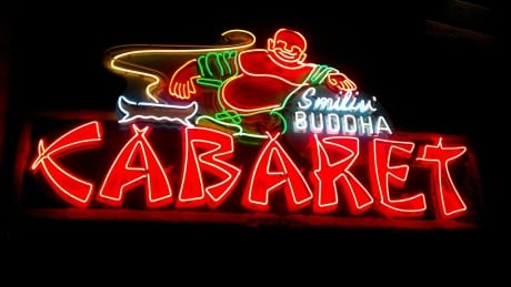 The Smilin' Buddha Cabaret was a beloved club at 109 East Hastings Street. It closed in 1992. Vancouver band 54-40 rescued the original sign and had it partially restored. Glow in the dark
