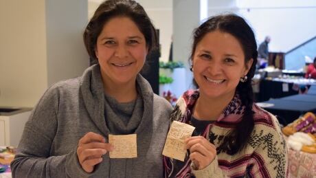 Sisters Jade McLeod, left, and Lili Miller, right, attended a weekend workshop at the conference on the traditional art of birchbark biting. Jade McLeod and Lili Miller indigenous art conference ottawa birchbark biting