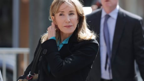 Actress Felicity Huffman arrives at federal court in Boston on Wednesday, April 3, 2019, to face charges in a nationwide college admissions bribery scandal. APTOPIX College Admissions Bribery