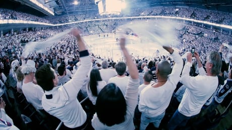 White-clad Winnipeg Jets fans celebrate at the start of the team's game against the St. Louis Blues on Wednesday, April 10, 2019. Jets whiteout