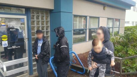 Clients line-up outside the Abbotsford welfare office, denied access to the centre's waiting room. People line-up outside the Abbotsford welfare office, denied access to waiting room