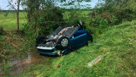 A car lies upside down in a ditch following a suspected tornado, Saturday, April 13, 2019 in Franklin, Texas. Severe Weather Texas