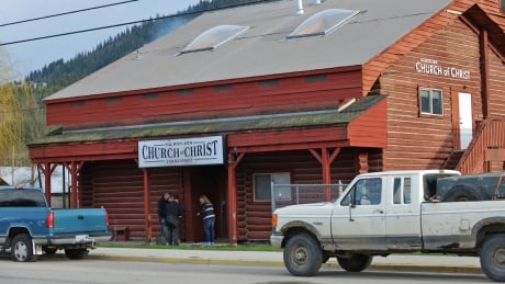 RCMP officers investigate a shooting at the Salmon Arm Church of Christ in Salmon Arm, B.C., on Sunday, April 14, 2019. A 25-year-old man is in custody following the shooting that left one dead and sent another to hospital on Sunday morning. Salmon Arm shooting