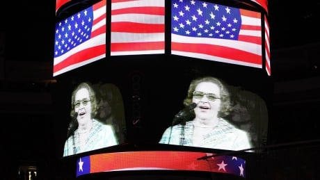 Kate Smith is seen on the screen before a Philadelphia Flyers game, something the team will no longer do due to racism allegations on some of the singer's past work. 102038356