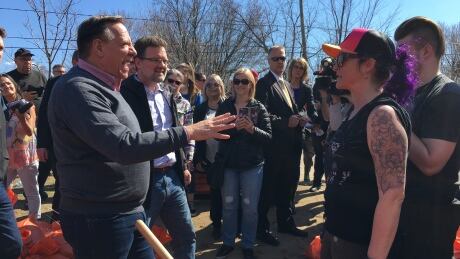 Quebec premier says province will cap flood compensation
