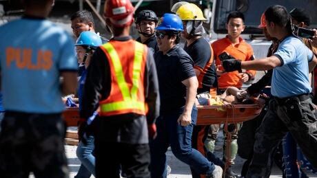 'We can still hear some voices': Race on to find survivors after deadly Philippine quake