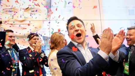 Ukraine's new comedian president gets hopeful welcome at home, chill from Putin