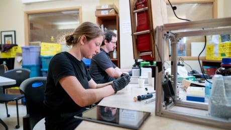 UVic chemistry co-op student Ashley Larnder, left, and UVic biochemist Ian Garber using the drug-checking equipment at Aids Vancouver Island in Victoria. Drug-checking program