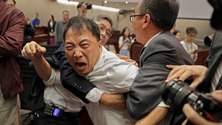 Chaotic scenes at Hong Kong legislature over extradition law