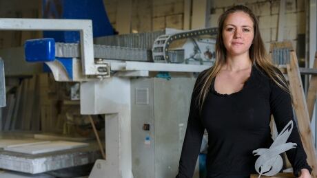 Lisa Peterson holds her Young Entrepreneur of the Year Award inside the Peterson
Stone Works warehouse in North Vancouver. Lisa Peterson