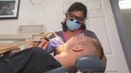A dentist gives Nickolas Dergousoff two fillings. Dergousoff says the clinic was his only option when he had a massive tooth infection last fall, and couldn't afford another dentist. Downtown Eastside Dental Clinic