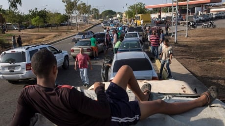 People line the street with their vehicles as they wait to fill up with gas at a fuel station, top right, in Cabimas, Venezuela, Wednesday, May 15, 2019. U.S. sanctions on oil-rich Venezuela appear to be taking hold, resulting in mile-long lines for fuel in the South American nation’s second-largest city, Maracaibo. Venezuela Gasoline Lines