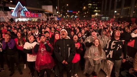 Fans in Toronto cheer for the Raptors outside Maple Leafs Square before their team's Game 7 victory over the Philadelphia 76ers in the second round of the NBA Playoffs. BKN 76ers Raptors 20190512