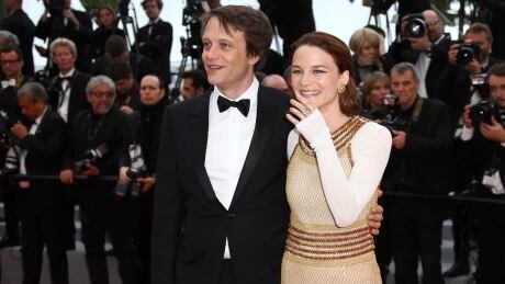 Actors August Diehl, left, and Valerie Pachner pose for photographers upon arrival at the premiere of the film 'A Hidden Life' at the 72nd international film festival, Cannes, southern France, Sunday, May 19, 2019. (Photo by Joel C Ryan/Invision/AP) France Cannes 2019 A Hidden Life Red Carpet