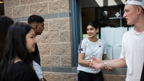 Students socialize at L.A. Matheson Secondary School in Surrey, B.C., on May 9, 2019. high school special Matheson multicultural