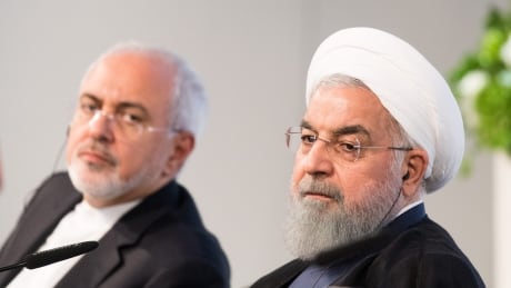 VIENNA, AUSTRIA - JULY 04: Iranian President Hassan Rouhani (R) and Mohammad Javad Zarif, Iran's foreign secretary, at the Austrian Chamber of Commerce on July 4, 2018 in Vienna, Austria. Rouhani is on a one-day visit to Austria, during which he is meeting with President van der Bellen and Chancellor Kurz and will attend an event at the Austrian Chamber of Commerce. 992977066